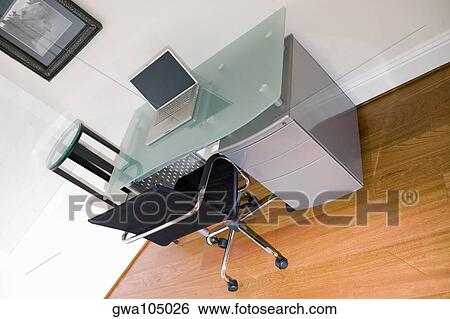 Laptop on a desk View Large Photo Image Stock Photograph - Laptop on a desk. Fotosearch