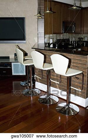 Row of chairs at a domestic kitchen View Large Photo Image Stock Photo - Row of chairs at a domestic kitchen. Fotosearch