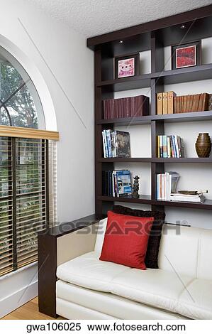 Stock Photography - Couch and shelves in a living room. Fotosearch