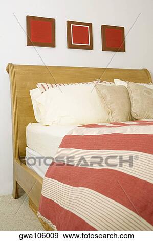 Cushions and pillows on the bed View Large Photo Image Stock Photo - Cushions and pillows on the bed. Fotosearch