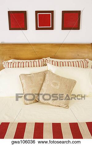 Cushions and pillows on the bed View Large Photo Image Stock Photograph - Cushions and pillows on the bed. Fotosearch