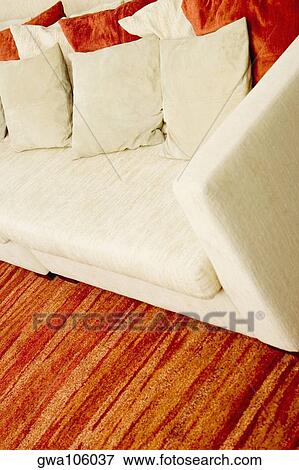 Stock Photo - Cushions on a couch in a living room. Fotosearch