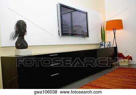 Flat panel television in a living room View Large Photo Image Stock Photo - Flat panel television in a living room. Fotosearch