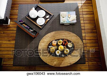 High angle view of tea cups and candles on a place mat View Large Photo Image Stock Image - High angle view of tea cups and candles on a place mat. Fotosearch