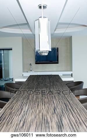 Lamp shade hanging over a table in a hotel View Large Photo Image Stock Image - Lamp shade hanging over a table in a hotel. Fotosearch