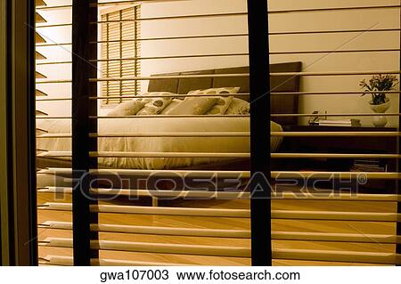 Bedroom viewed through a window View Large Photo Image Stock Image - Bedroom viewed through a window. Fotosearch