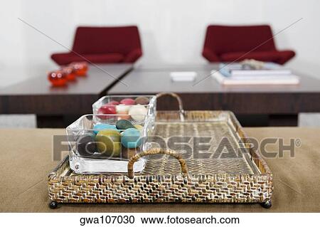 Stock Image - Close-up of colored stones in a serving tray. Fotosearch