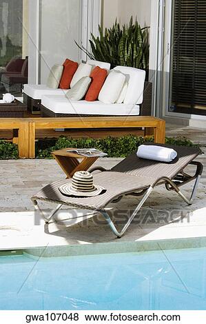 Lounge chair at the poolside View Large Photo Image Stock Photo - Lounge chair at the poolside. Fotosearch