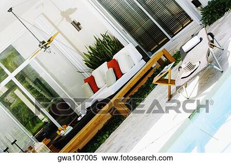 Stock Photography - Lounge chair at the poolside. Fotosearch