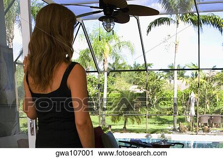 Rear view of a mature woman View Large Photo Image Stock Image - Rear view of a mature woman. Fotosearch