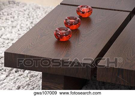 Three candles on a table View Large Photo Image Stock Photo - Three candles on a table. Fotosearch