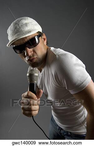 Close-up of a male singer singing View Large Photo Image Stock Photo - Close-up of a male singer singing. Fotosearch