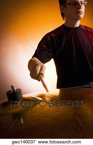 Male drummer playing drums View Large Photo Image Stock Photo - Male drummer playing drums. Fotosearch