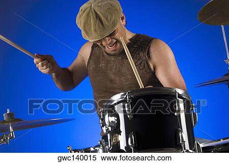 Male drummer playing drums View Large Photo Image Stock Photography - Male drummer playing drums. Fotosearch