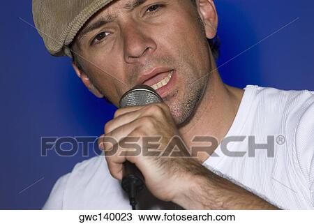 Stock Image - Portrait of a male singer singing. Fotosearch