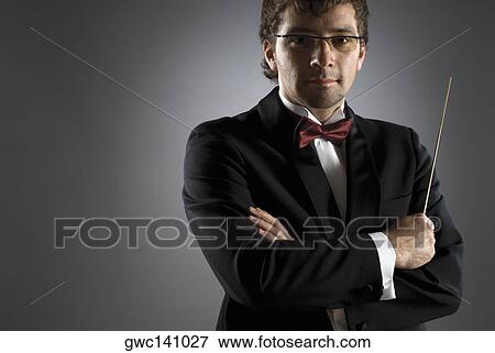 Close-up of a musician holding a conductor's baton View Large Photo Image Stock Photo - Close-up of a musician holding a conductor's baton. Fotosearch