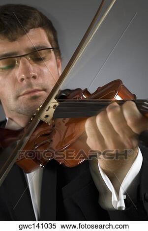 Stock Photography - Close-up of a musician playing a violin. Fotosearch