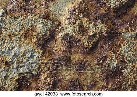 Stock Image - Close-up of a damaged wall. Fotosearch