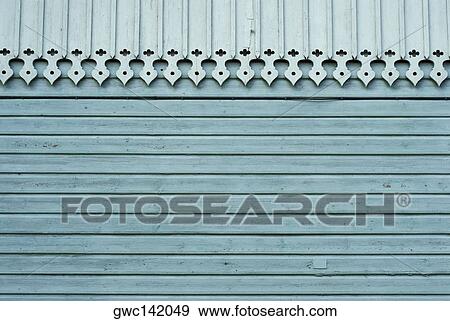 Close-up of a decorated roof on a wooden wall View Large Photo Image Stock Photo - Close-up of a decorated roof on a wooden wall. Fotosearch