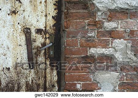 Close-up of a rusty door View Large Photo Image Stock Photo - Close-up of a rusty door. Fotosearch