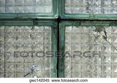 Close-up of the broken glass of a window View Large Photo Image Stock Photography - Close-up of the broken glass of a window. Fotosearch
