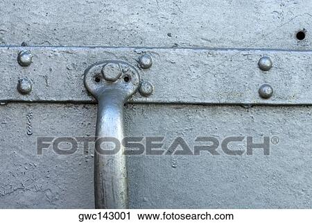Stock Image - Close-up of a door handle. Fotosearch