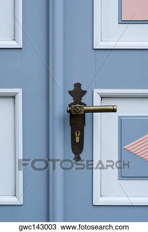 Stock Image - Close-up of a door handle. Fotosearch