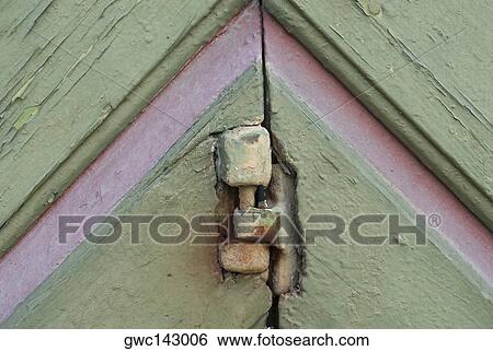 Close-up of a hinge on an old door View Large Photo Image Stock Photograph - Close-up of a hinge on an old door. Fotosearch