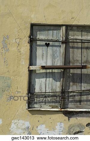 Close-up of an old window on a weathered wall View Large Photo Image Stock Image - Close-up of an old window on a weathered wall. Fotosearch