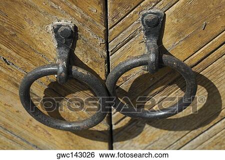 Close-up of metal doorknockers View Large Photo Image Stock Photograph - Close-up of metal doorknockers. Fotosearch