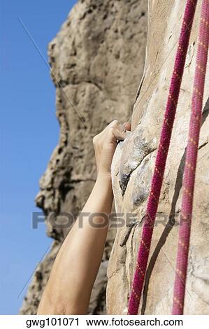 Close-up of a climber's hand scaling a rock face View Large Photo Image Stock Image - Close-up of a climber's hand scaling a rock face. Fotosearch