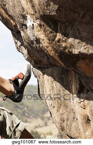Stock Photo - Close-up of a rock climber's foot. Fotosearch