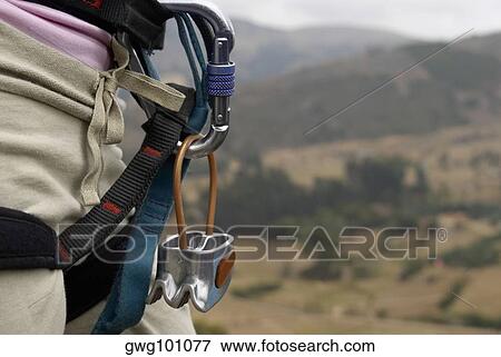 Mid section view of a rock climber carrying rock climbing equipments View Large Photo Image Stock Photo - Mid section view of a rock climber carrying rock climbing equipments. Fotosearch