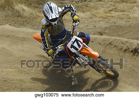 High angle view of a motocross rider riding a motorcycle View Large Photo Image Stock Photography - High angle view of a motocross rider riding a motorcycle. Fotosearch