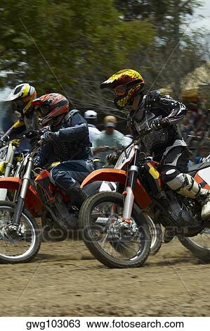 Side profile of three motocross riders riding motorcycles View Large Photo Image Stock Image - Side profile of three motocross riders riding motorcycles. Fotosearch