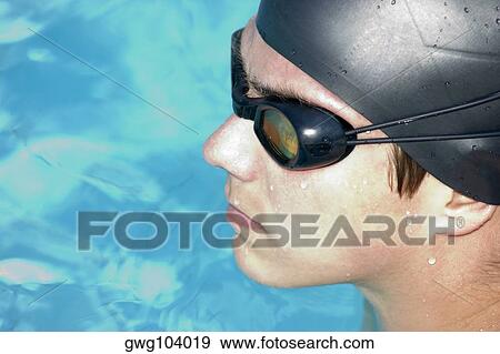 Close-up of a young man in a swimming pool View Large Photo Image Stock Photo - Close-up of a young man in a swimming pool. Fotosearch