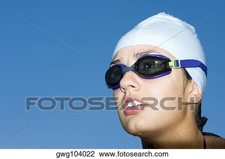 Close-up of a young woman in swimwear View Large Photo Image Stock Image - Close-up of a young woman in swimwear. Fotosearch