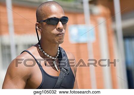 Close-up of a mid adult man making a face View Large Photo Image Stock Image - Close-up of a mid adult man making a face. Fotosearch