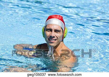 Portrait of a mid adult man holding a ball in a swimming pool View Large Photo Image Stock Photo - Portrait of a mid adult man holding a ball in a swimming pool. Fotosearch