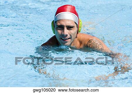 Portrait of a mid adult man swimming in a swimming pool View Large Photo Image Stock Image - Portrait of a mid adult man swimming in a swimming pool. Fotosearch