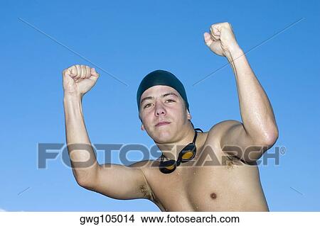 Portrait of a young man clenching his fists View Large Photo Image Picture - Portrait of a young man clenching his fists. Fotosearch