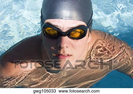Portrait of a young man in a swimming pool View Large Photo Image Stock Image - Portrait of a young man in a swimming pool. Fotosearch