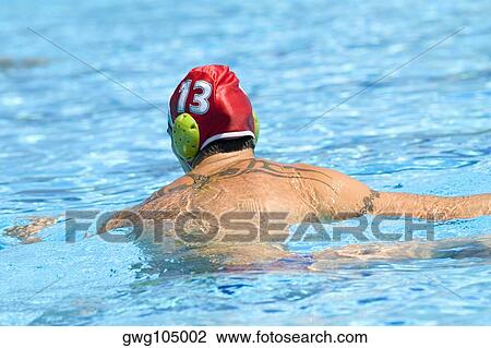 Rear view of a mid adult man in a swimming pool View Large Photo Image Stock Image - Rear view of a mid adult man in a swimming pool. Fotosearch