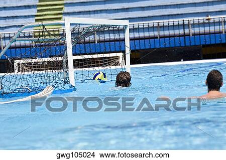 Two men playing water polo in a swimming pool View Large Photo Image Picture - Two men playing water polo in a swimming pool. Fotosearch