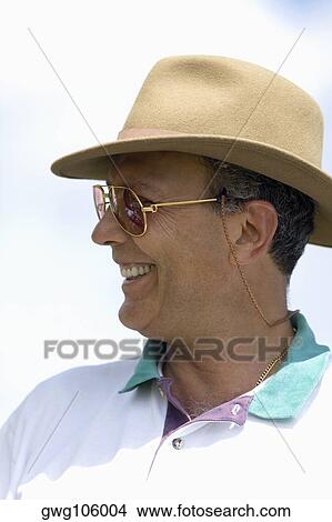 Close-up of a mature man smiling View Large Photo Image Picture - Close-up of a mature man smiling. Fotosearch