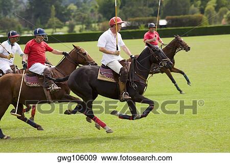 Stock Photo - Four polo players playing polo. Fotosearch