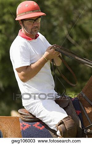 Mature man riding a horse View Large Photo Image Stock Image - Mature man riding a horse. Fotosearch