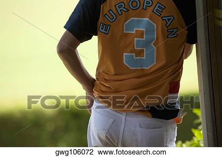 Mid section view of a player standing with his hand in his pocket View Large Photo Image Stock Image - Mid section view of a player standing with his hand in his pocket. Fotosearch