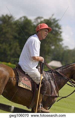 Side profile of a senior man playing polo View Large Photo Image Stock Image - Side profile of a senior man playing polo. Fotosearch