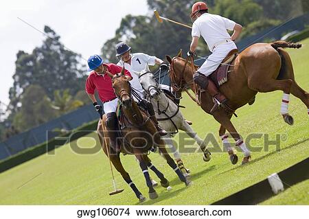 Picture - Three polo players playing polo. Fotosearch